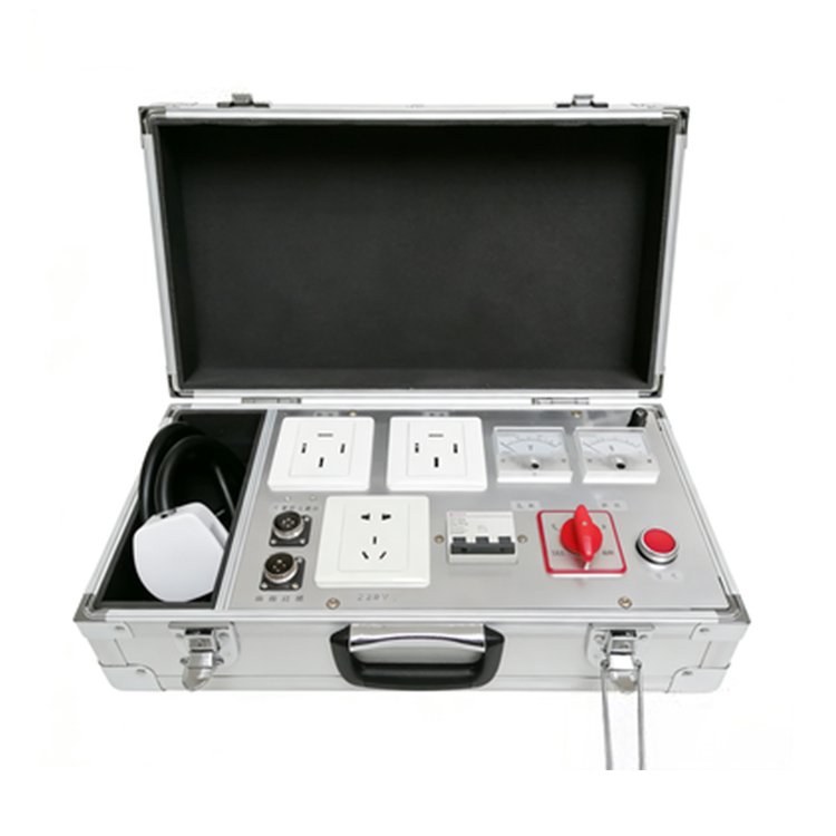 Portable electrical distribution test kit in a metal carry case, featuring power sockets, meters, switches, and a safety button for on-site use.