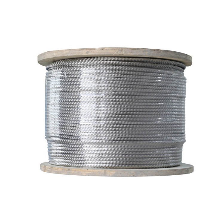 Coiled galvanized steel wire rope on wooden reel, suitable for industrial lifting and construction applications.