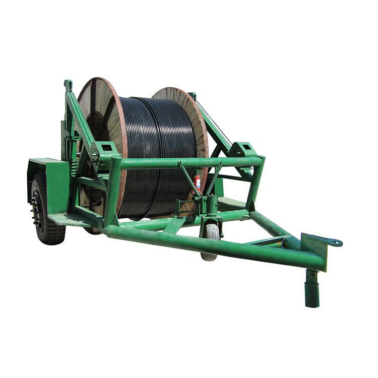 Green portable cable reel trailer with large wooden spool of black cable, built for easy wire transport and deployment in utility or construction work