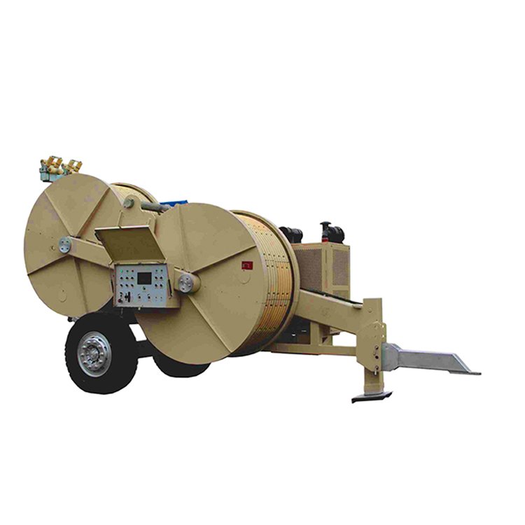Mobile hydraulic cable puller trailer with large reels, ideal for power line installation and construction projects.