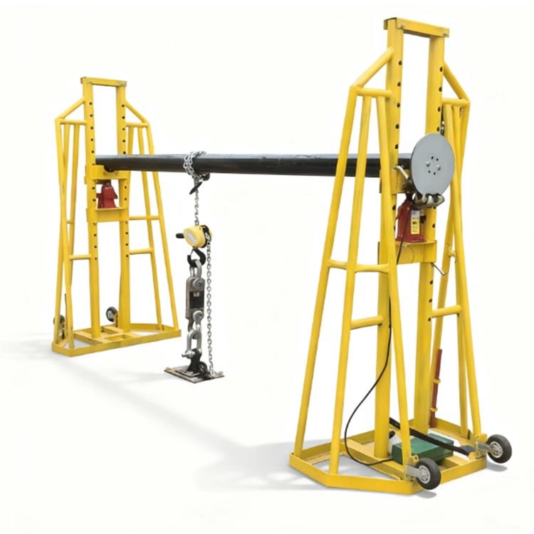 Yellow hydraulic pipe lifting stands with chain hoist holding black pipe, featuring wheels for maneuverability, used for heavy pipe handling.