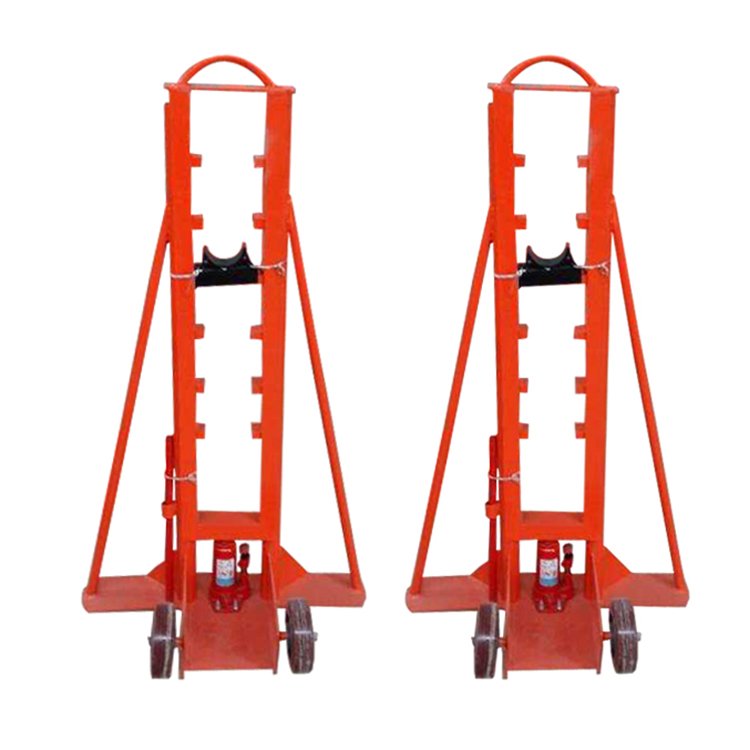Two red hydraulic cable reel stands with wheels, hydraulic jacks, and sturdy frames for lifting cable reels in industrial applications.
