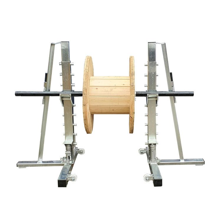 Adjustable metal cable reel stand holding a wooden wire spool, with height adjustment and wheels for mobility in electrical/construction work.