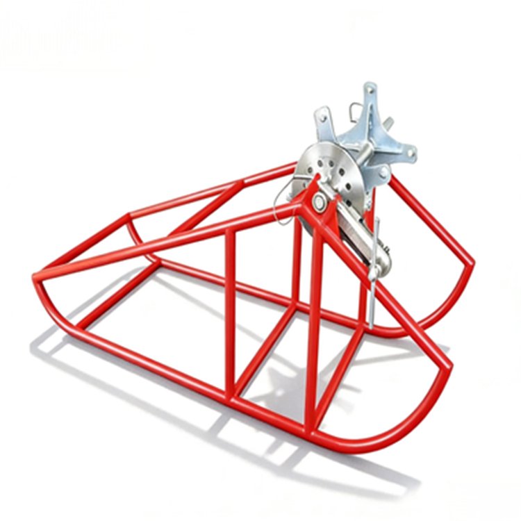Red metal excavator cable reel frame with winch mechanism, built for cable handling in construction and utility applications