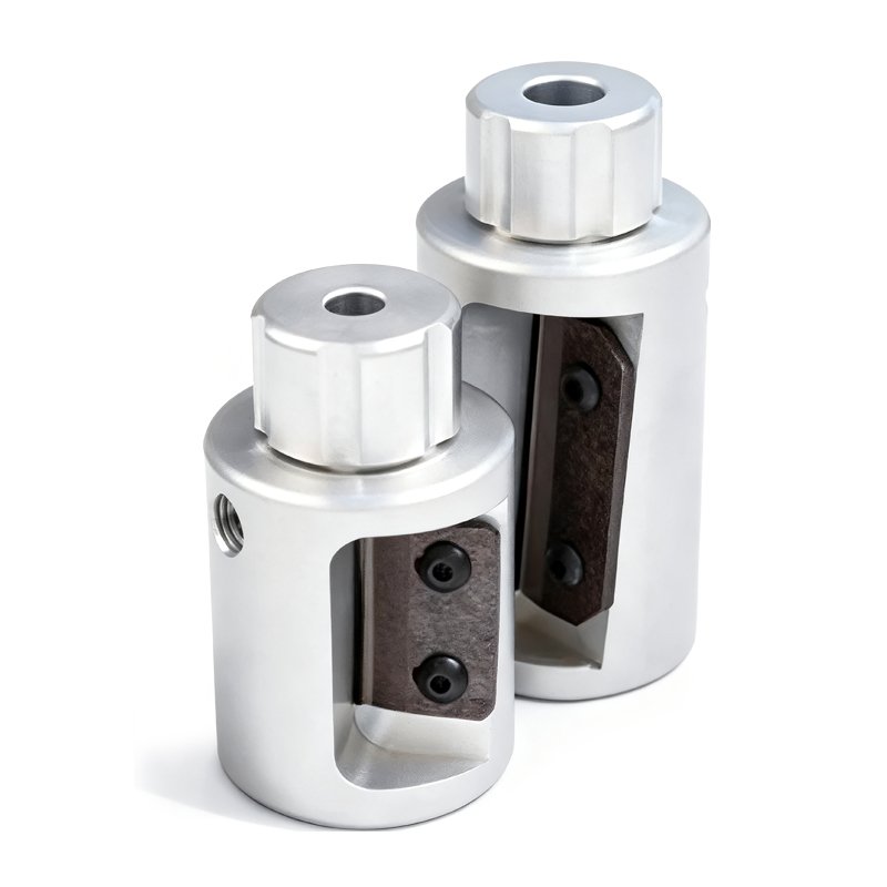 Two silver excavator quick coupler adapters with brown inserts, built for secure tool attachment in construction.