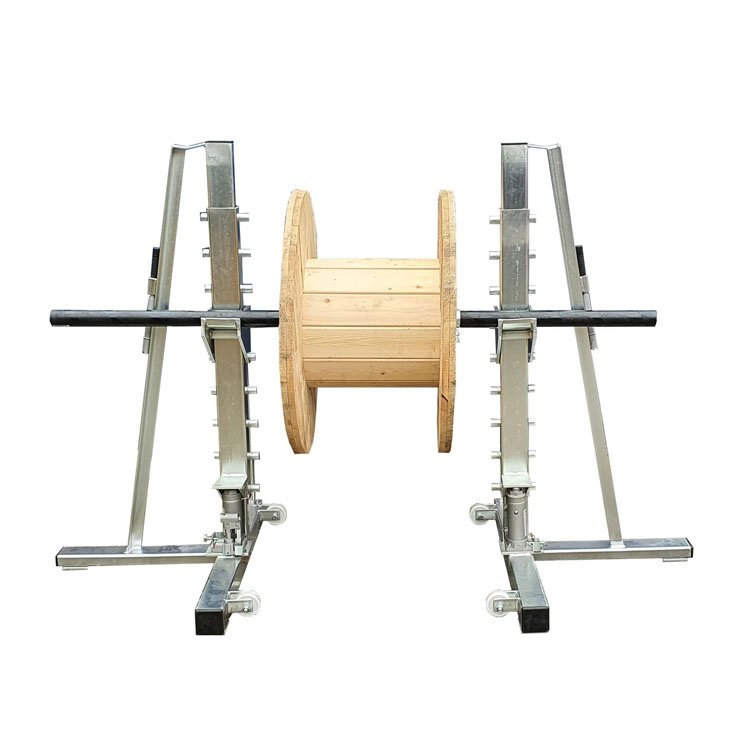 cable drum jack holding empty wooden reel front view
