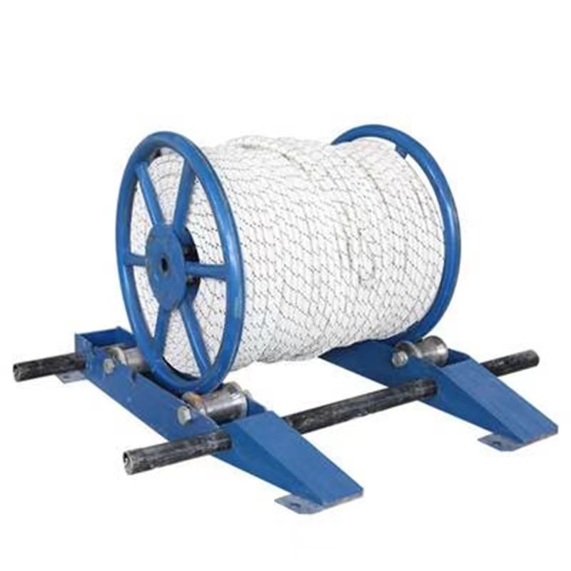 cable reel roller stand front view with loaded reel on blue base